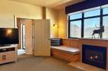 This cozy living space features a built-in bench seat, perfect for relaxing and enjoying the view.