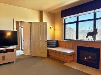 This cozy living space features a built-in bench seat, perfect for relaxing and enjoying the view.