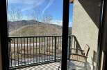 Enjoy breathtaking mountain views from this charming balcony.