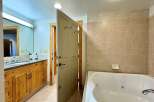 Step into a luxurious bathroom featuring a spacious jacuzzi tub, perfect for relaxation.