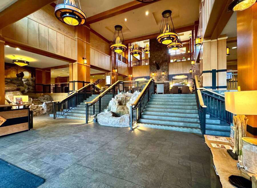 Step into luxury at this stunning property, featuring a grand entrance with a cascading waterfall and elegant staircases.