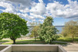 Enjoy stunning views from this property, featuring lush greenery and a serene waterfront.