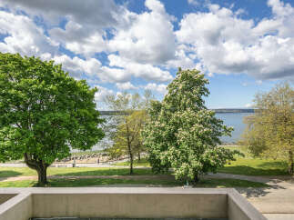 Enjoy stunning views from this property, featuring lush greenery and a serene waterfront.