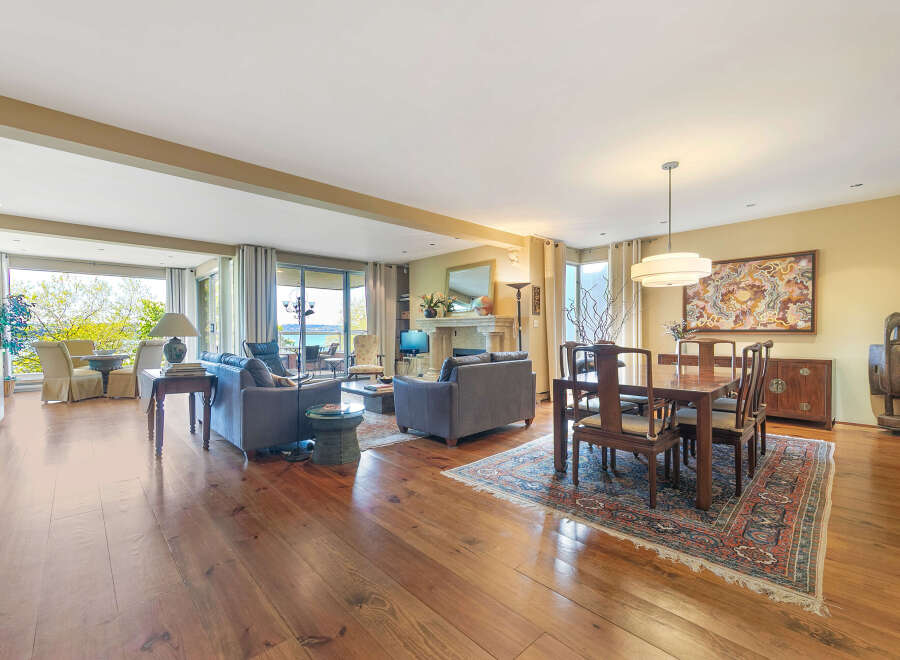 Experience luxury living in this stunning property, featuring a spacious open floor plan with beautiful hardwood floors throughout.
