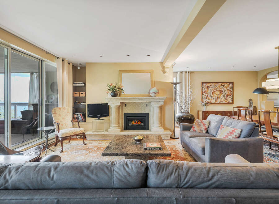 This stunning living room boasts a cozy fireplace, perfect for relaxing evenings.