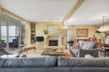 This stunning living room boasts a cozy fireplace, perfect for relaxing evenings.