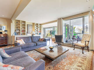Step into luxury with this stunning living room, featuring a spacious layout and elegant design.