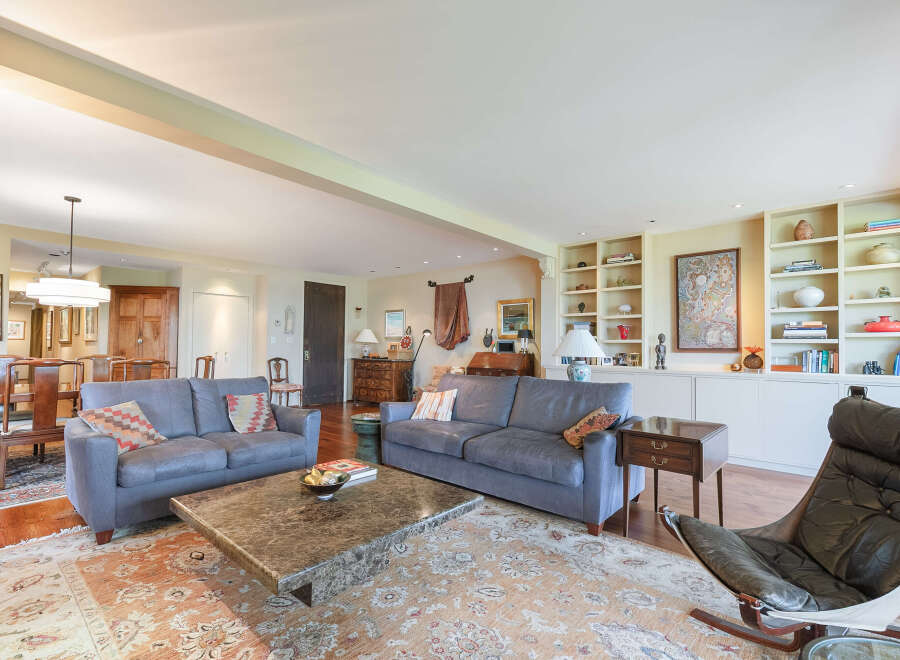 Step into luxury with this stunning living room, featuring two elegant sofas and a stylish marble coffee table.