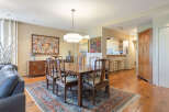 Step into this elegant dining room, featuring a beautiful wooden dining table and chairs, perfect for hosting gatherings.