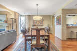 Step into luxury with this stunning dining room, featuring a beautiful wooden dining table and chairs.