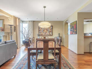 Step into luxury with this stunning dining room, featuring a beautiful wooden dining table and chairs.