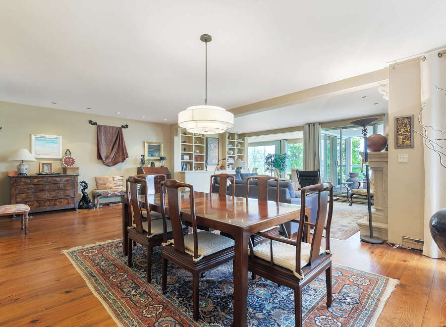 Step into luxury with this stunning dining room, featuring a beautiful wooden dining table and chairs.