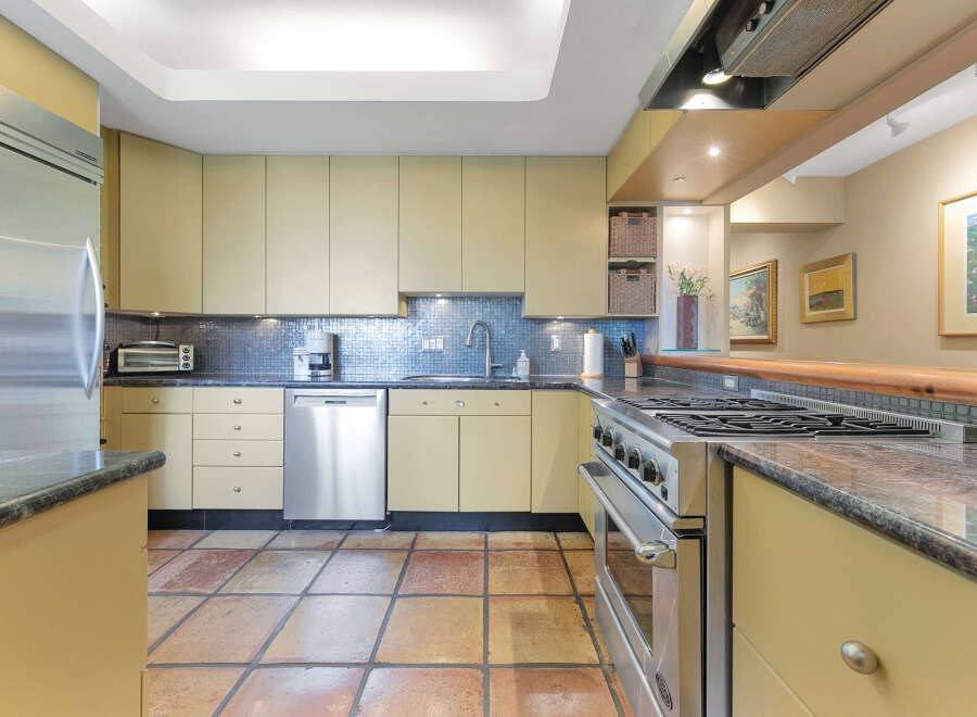 This stunning kitchen boasts a modern design with sleek cabinetry and stainless steel appliances.