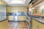 This stunning kitchen boasts a modern design with sleek cabinetry and stainless steel appliances.
