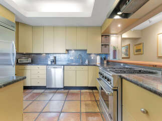 This stunning kitchen boasts a modern design with sleek cabinetry and stainless steel appliances.