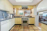 This stunning kitchen boasts a modern design with sleek cabinetry and stainless steel appliances.