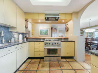 This stunning kitchen boasts a modern design with sleek cabinetry and stainless steel appliances.