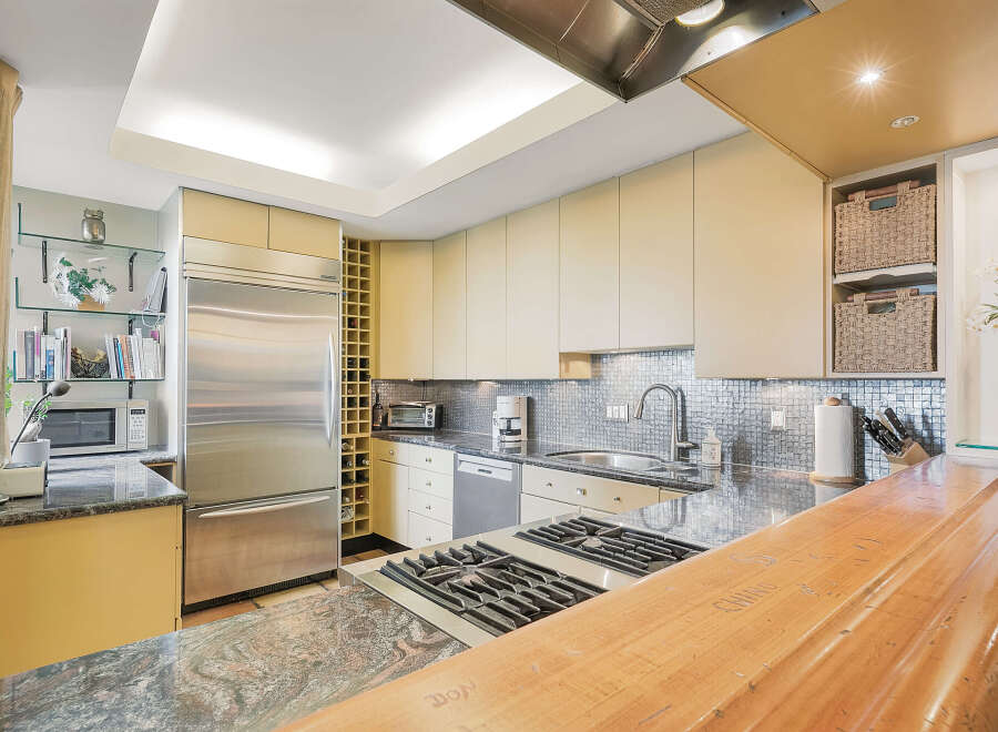 This stunning kitchen boasts modern design with high-end appliances and ample counter space.