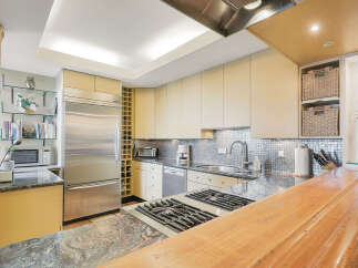 This stunning kitchen boasts modern design with high-end appliances and ample counter space.