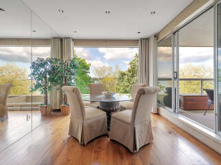 This stunning dining area offers breathtaking views and a seamless connection to the outdoors.