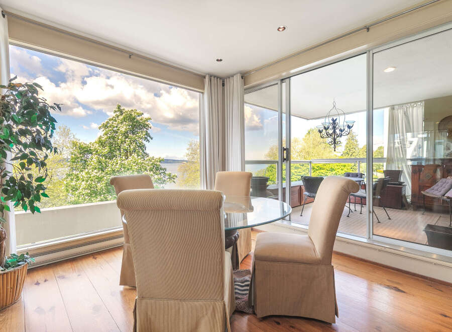 Enjoy breathtaking views from this stunning property, featuring a bright and airy dining area with floor-to-ceiling windows.
