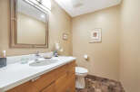This stunning bathroom features a modern design with a sleek vanity and a stylish mirror.