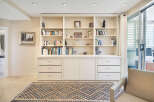 This stunning property boasts a custom-built bookshelf, perfect for displaying your literary collection and decorative items.