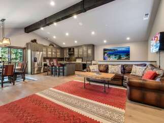 Step into luxury with this stunning property, featuring a spacious open-concept living area.