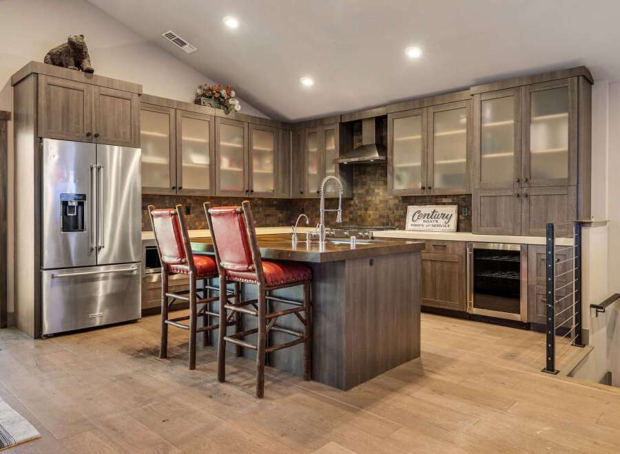 This stunning kitchen boasts a modern design with high-end appliances and custom cabinetry.