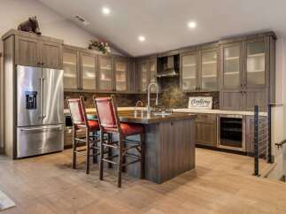 This stunning kitchen boasts a modern design with high-end appliances and custom cabinetry.