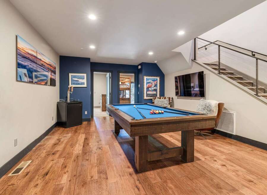 This stunning property boasts a beautifully designed game room, perfect for entertaining and relaxation.