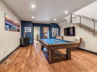 This stunning property boasts a beautifully designed game room, perfect for entertaining and relaxation.