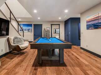 This stunning property boasts a luxurious game room, perfect for entertaining.