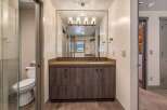 Step into luxury with this stunning bathroom! Featuring a modern vanity with ample storage, a sleek countertop, and a large mirror, this space is designed for both style and functionality.