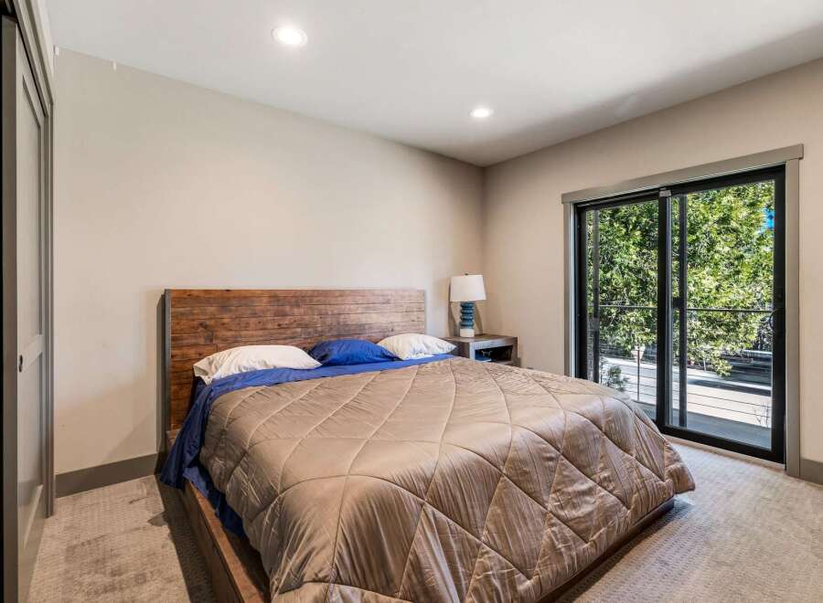 This stunning bedroom boasts a modern design with a touch of rustic charm.
