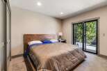 This stunning bedroom boasts a modern design with a touch of rustic charm.