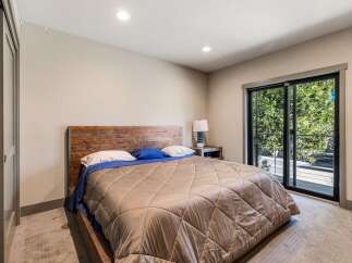 This stunning bedroom boasts a modern design with a touch of rustic charm.