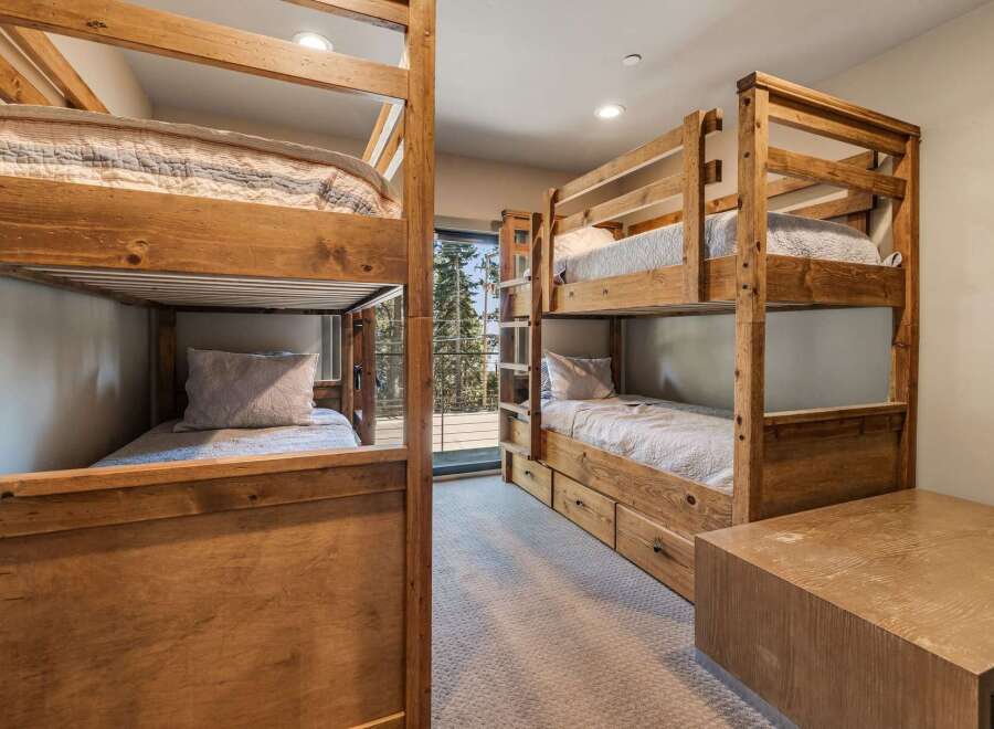 This stunning property features a cozy bunk room, perfect for accommodating guests or family.