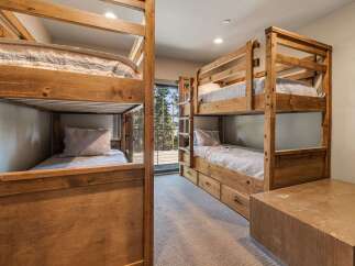 This stunning property features a cozy bunk room, perfect for accommodating guests or family.