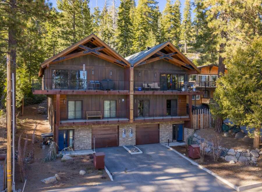 Discover luxury living in this stunning mountain home! This property boasts a modern design with spacious balconies, perfect for enjoying the breathtaking views.