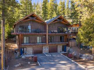 Discover luxury living in this stunning mountain home! This property boasts a modern design with spacious balconies, perfect for enjoying the breathtaking views.