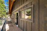Discover the charm of this stunning property, featuring a beautifully designed exterior with rich wooden siding.