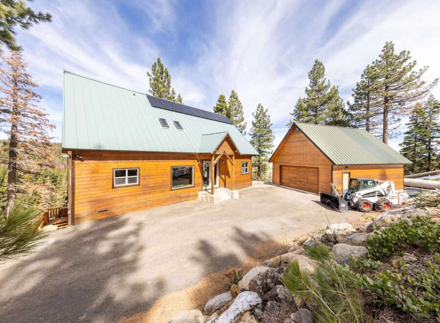 Discover your dream retreat in this stunning property! This home boasts a modern design with a unique roofline and solar panels, offering both style and sustainability.