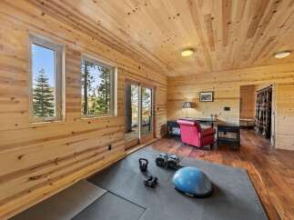 This stunning property boasts a beautifully designed home gym, perfect for maintaining a healthy lifestyle.