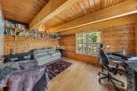 Step into this cozy cabin retreat, featuring a warm wooden interior and a bright, inviting atmosphere.