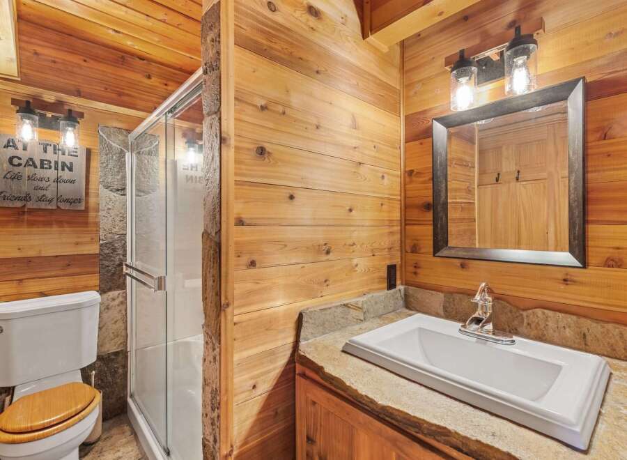 Step into rustic elegance with this stunning bathroom.