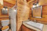 Step into rustic elegance with this stunning bathroom.