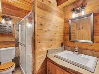 Step into rustic elegance with this stunning bathroom.