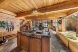 Experience luxury living in this stunning home with a gourmet kitchen featuring a Jenn-Air cooktop and a spacious island.