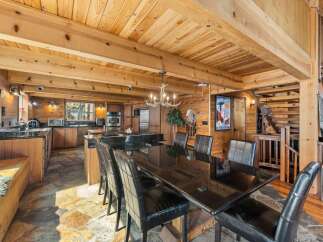 Step into rustic elegance with this stunning property featuring a spacious kitchen and dining area.